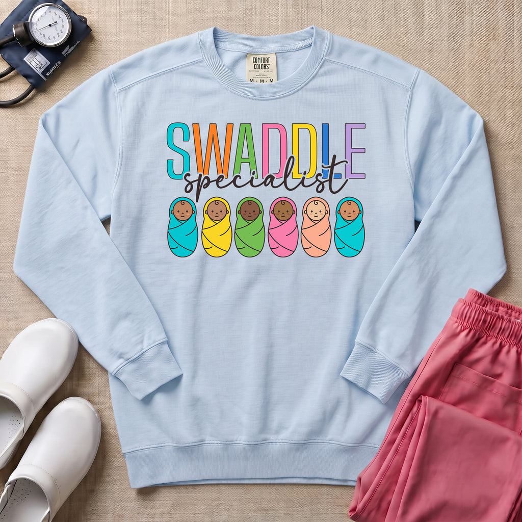 NICU Postpartum Nurse Swaddle Specialist Sweatshirt - Chambray Comfort Colors Sweatshirt | HugTee