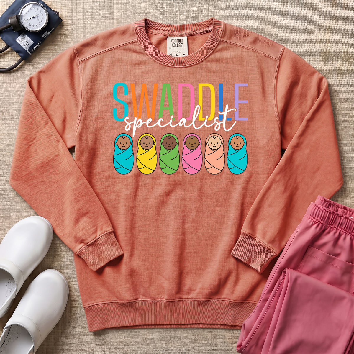 NICU Postpartum Nurse Swaddle Specialist Sweatshirt - Terracotta Comfort Colors Sweatshirt | HugTee