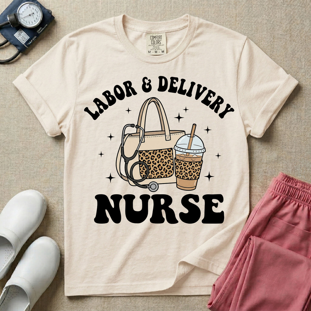 A Labor and Delivery nurse graphic featuring a large beige tote bag with a leopard print pocket, a stethoscope draped over it, and a large iced coffee cup with a matching leopard print sleeve, all surrounded by white text that reads LABOR & DELIVERY curved above and NURSE below.