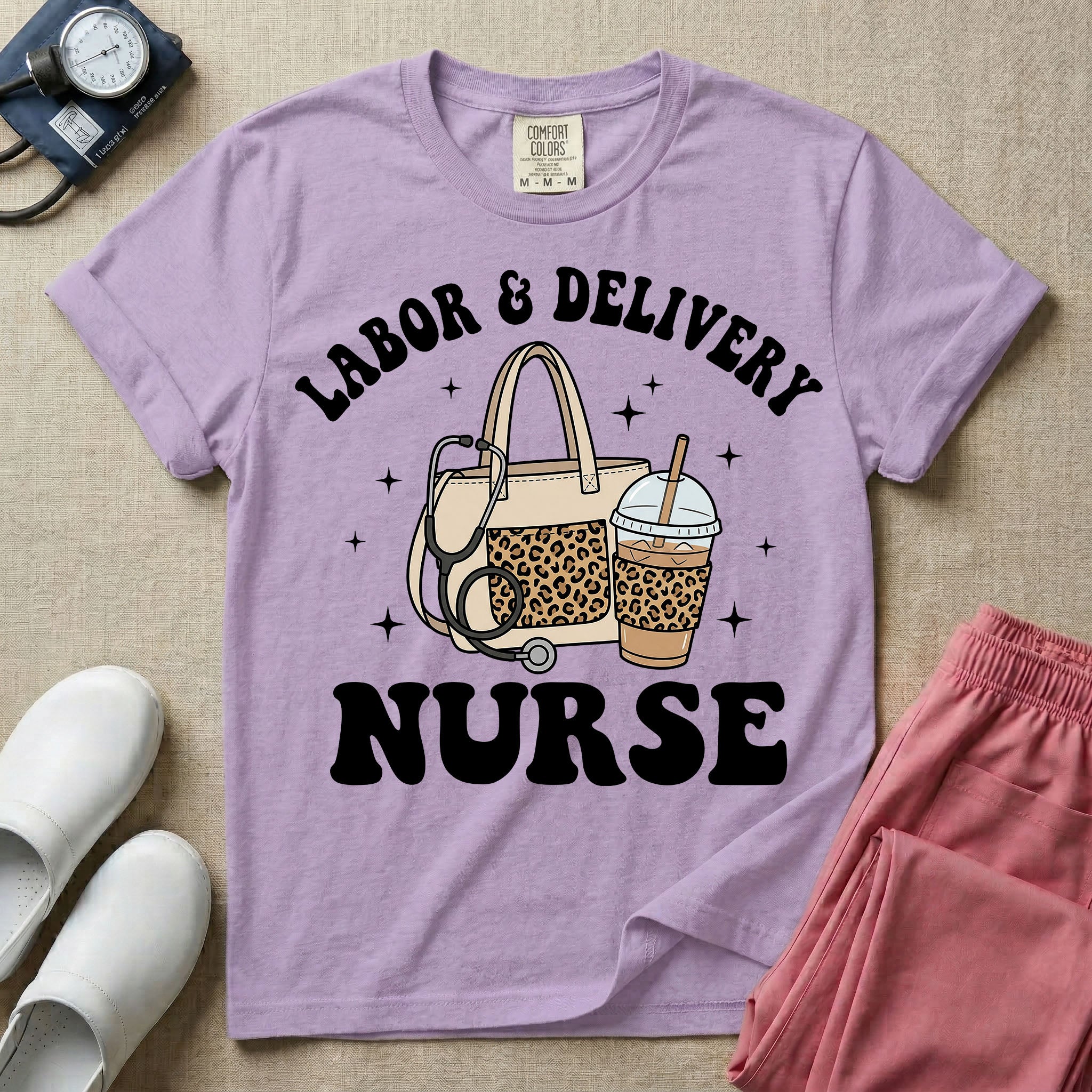 A Labor and Delivery nurse graphic featuring a large beige tote bag with a leopard print pocket, a stethoscope draped over it, and a large iced coffee cup with a matching leopard print sleeve, all surrounded by white text that reads LABOR & DELIVERY curved above and NURSE below.
