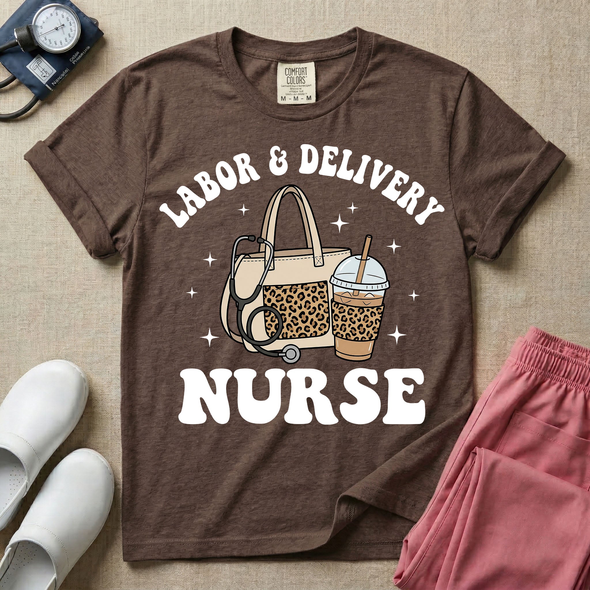 A Labor and Delivery nurse graphic featuring a large beige tote bag with a leopard print pocket, a stethoscope draped over it, and a large iced coffee cup with a matching leopard print sleeve, all surrounded by white text that reads LABOR & DELIVERY curved above and NURSE below.