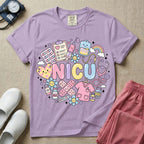 A cute Neonatal Intensive Care Unit nurse graphic featuring the word NICU in large pastel bubble letters, surrounded by a circular arrangement of adorable, smiling kawaii-style medical and baby supplies including a milk bottle, stethoscope, syringe, IV bag, and a tiny scrub top.