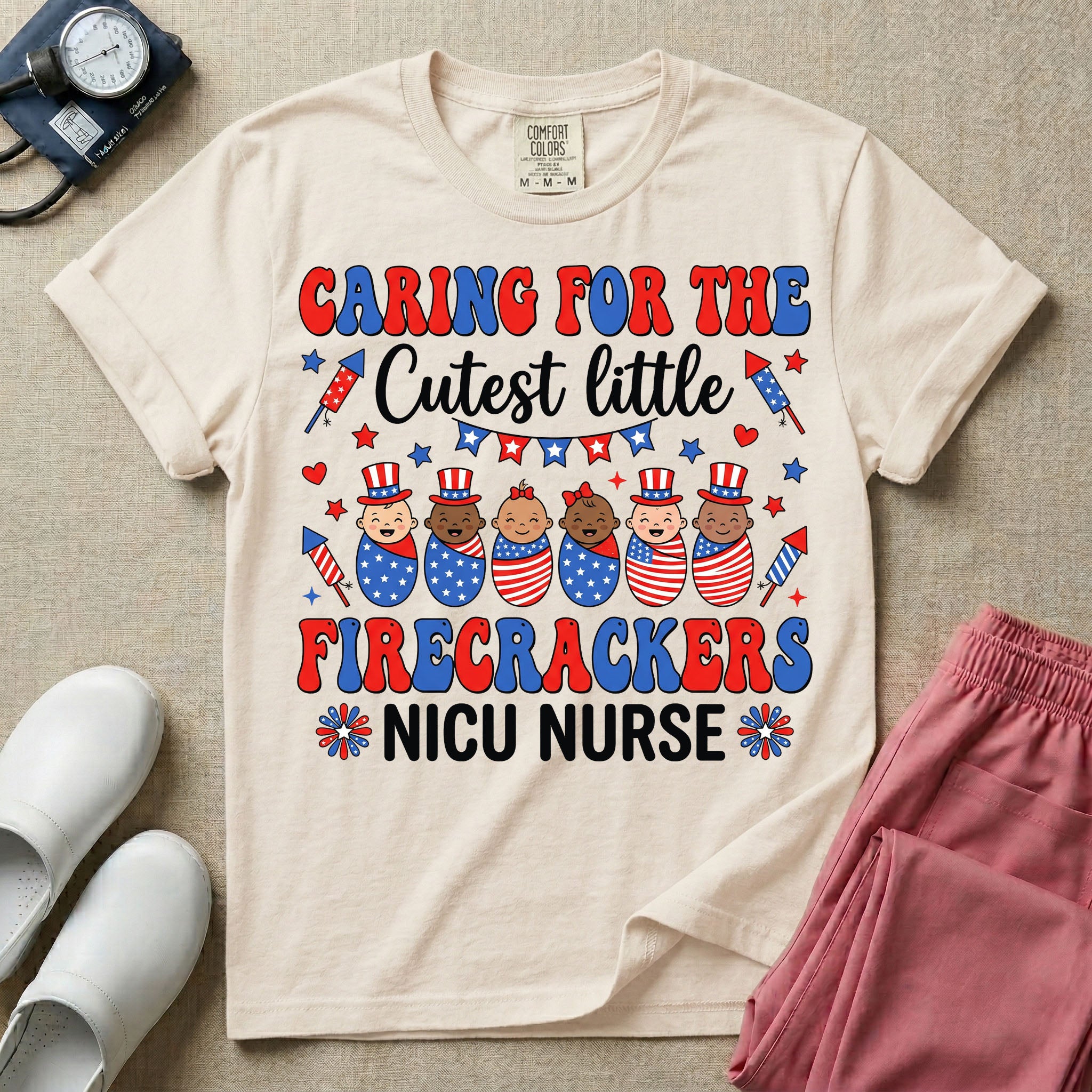 A cute Neonatal Intensive Care Unit nurse graphic featuring a row of diverse babies wrapped in patriotic red, white, and blue star-spangled and striped swaddles, with some wearing top hats, surrounded by fireworks and star bunting, alongside retro text reading CARING FOR THE Cutest little FIRECRACKERS NICU NURSE.