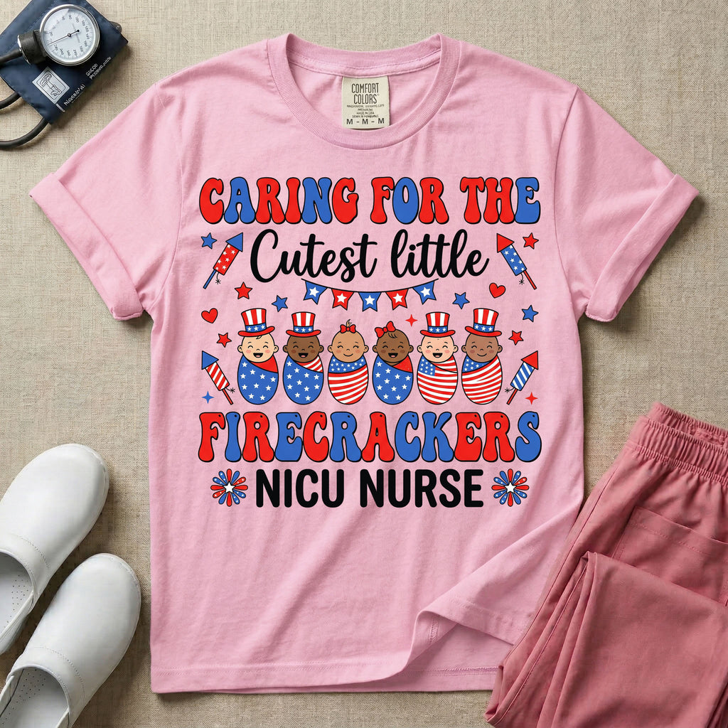 A cute Neonatal Intensive Care Unit nurse graphic featuring a row of diverse babies wrapped in patriotic red, white, and blue star-spangled and striped swaddles, with some wearing top hats, surrounded by fireworks and star bunting, alongside retro text reading CARING FOR THE Cutest little FIRECRACKERS NICU NURSE.