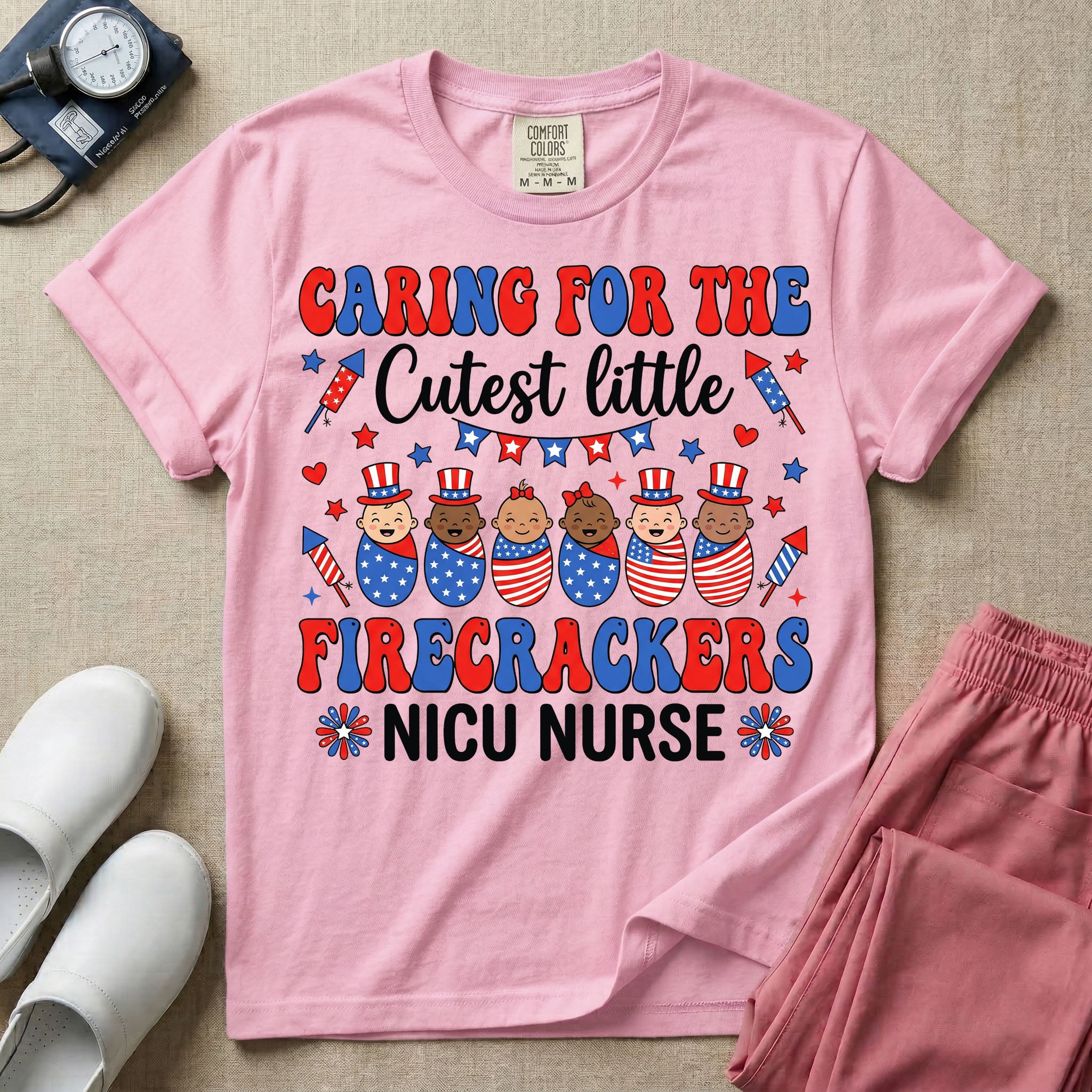A cute Neonatal Intensive Care Unit nurse graphic featuring a row of diverse babies wrapped in patriotic red, white, and blue star-spangled and striped swaddles, with some wearing top hats, surrounded by fireworks and star bunting, alongside retro text reading CARING FOR THE Cutest little FIRECRACKERS NICU NURSE.