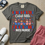 A cute Neonatal Intensive Care Unit nurse graphic featuring a row of diverse babies wrapped in patriotic red, white, and blue star-spangled and striped swaddles, with some wearing top hats, surrounded by fireworks and star bunting, alongside retro text reading CARING FOR THE Cutest little FIRECRACKERS NICU NURSE.