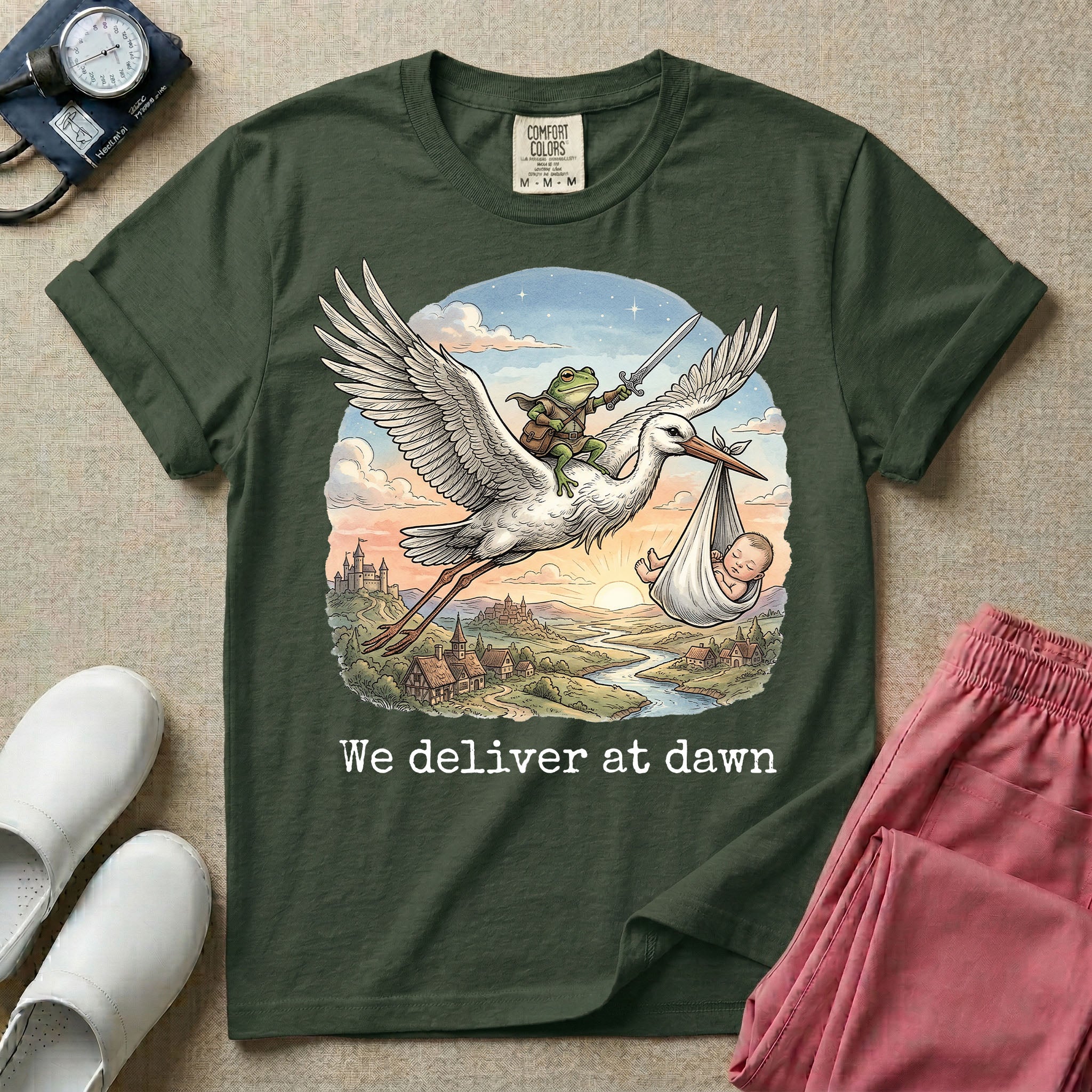 A humorous Labor and Delivery graphic featuring a storybook illustration of a frog dressed as a knight wielding a sword, riding on the back of a flying stork that is carrying a sleeping baby in a bundle, soaring over a fantasy landscape with a castle at sunrise, accompanied by text below that reads We deliver at dawn.