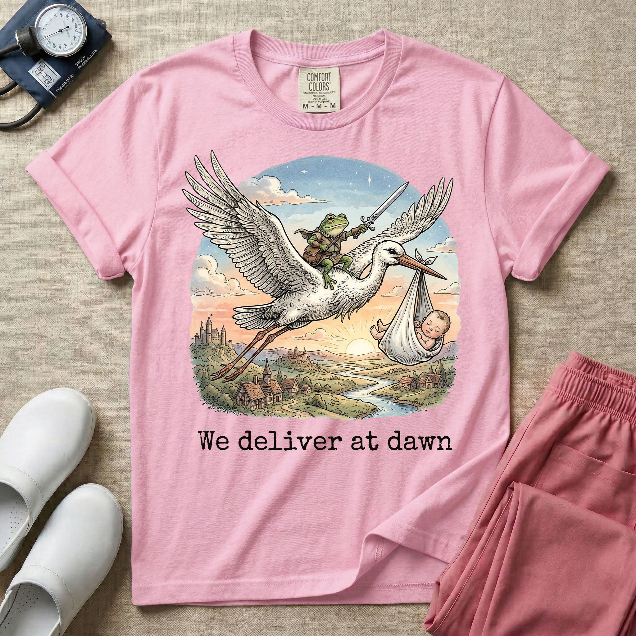 A humorous Labor and Delivery graphic featuring a storybook illustration of a frog dressed as a knight wielding a sword, riding on the back of a flying stork that is carrying a sleeping baby in a bundle, soaring over a fantasy landscape with a castle at sunrise, accompanied by text below that reads We deliver at dawn.