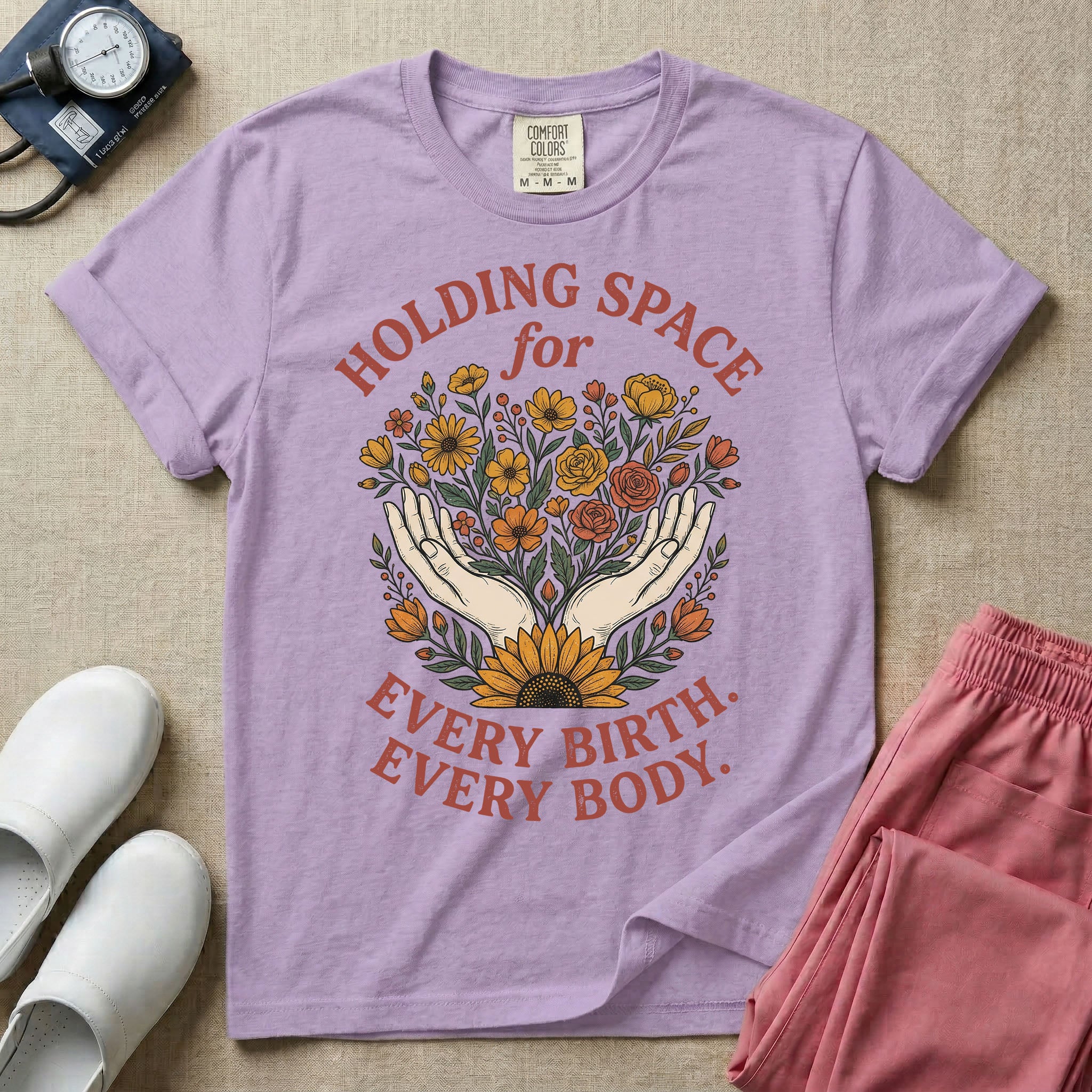 A Labor and Delivery and Doula graphic featuring an illustration of two open hands gently holding a bouquet of wildflowers with a large sunflower at the base, surrounded by white text that reads HOLDING SPACE for above and EVERY BIRTH. EVERY BODY. below.