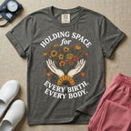 A Labor and Delivery and Doula graphic featuring an illustration of two open hands gently holding a bouquet of wildflowers with a large sunflower at the base, surrounded by white text that reads HOLDING SPACE for above and EVERY BIRTH. EVERY BODY. below.