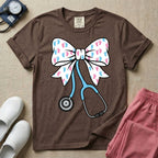 Labor and Delivery & NICU nurse graphic featuring a large white coquette bow patterned with pink and blue baby footprints and an attached blue stethoscope.