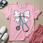 Labor and Delivery & NICU nurse graphic featuring a large white coquette bow patterned with pink and blue baby footprints and an attached blue stethoscope.