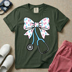 Labor and Delivery & NICU nurse graphic featuring a large white coquette bow patterned with pink and blue baby footprints and an attached blue stethoscope.