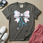 Labor and Delivery & NICU nurse graphic featuring a large white coquette bow patterned with pink and blue baby footprints and an attached blue stethoscope.