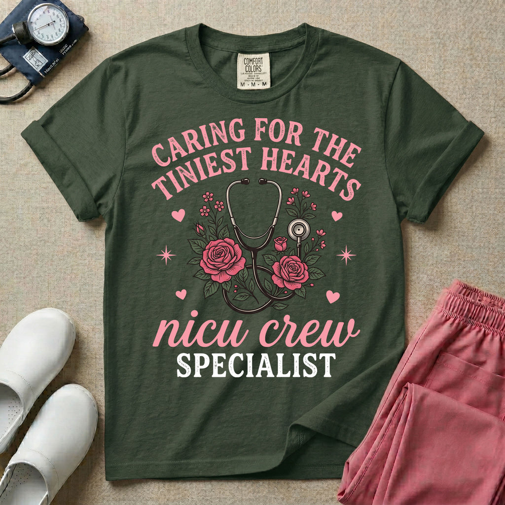 NICU nurse graphic featuring a stethoscope intertwined with pink roses, stars, and hearts, surrounded by the text "Caring for the tiniest hearts nicu crew SPECIALIST".