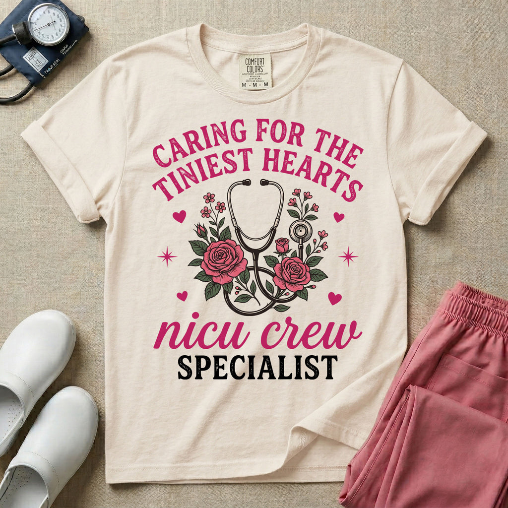 NICU nurse graphic featuring a stethoscope intertwined with pink roses, stars, and hearts, surrounded by the text "Caring for the tiniest hearts nicu crew SPECIALIST".