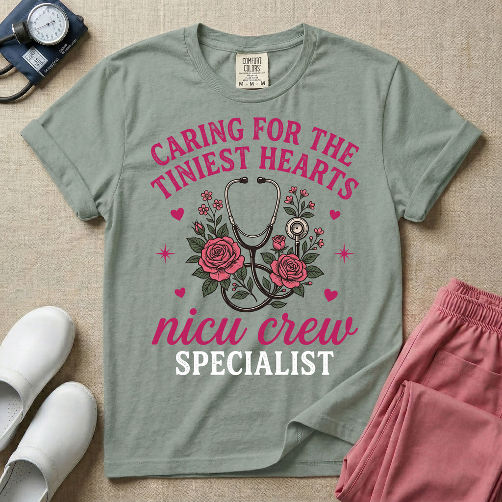 NICU nurse graphic featuring a stethoscope intertwined with pink roses, stars, and hearts, surrounded by the text "Caring for the tiniest hearts nicu crew SPECIALIST".
