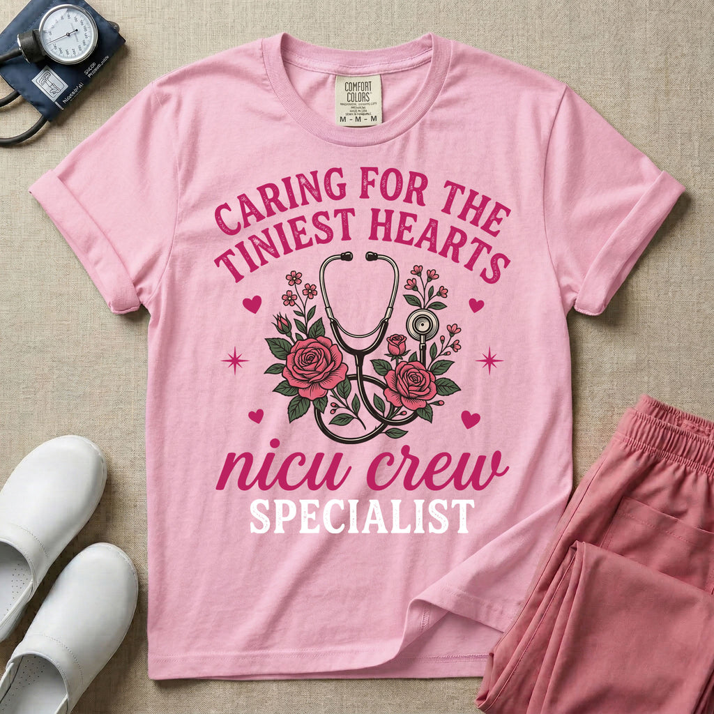 NICU nurse graphic featuring a stethoscope intertwined with pink roses, stars, and hearts, surrounded by the text "Caring for the tiniest hearts nicu crew SPECIALIST".