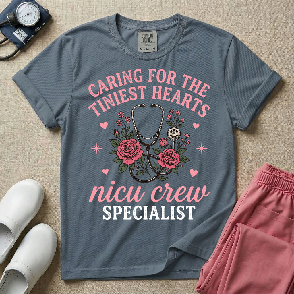 NICU nurse graphic featuring a stethoscope intertwined with pink roses, stars, and hearts, surrounded by the text "Caring for the tiniest hearts nicu crew SPECIALIST".
