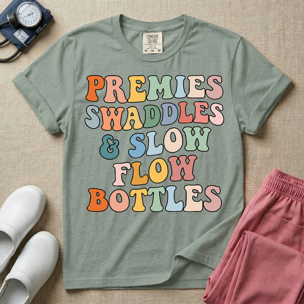 NICU nurse graphic featuring the phrase PREMIES SWADDLES & SLOW FLOW BOTTLES written in colorful retro wavy bubble letters.
