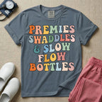 NICU nurse graphic featuring the phrase PREMIES SWADDLES & SLOW FLOW BOTTLES written in colorful retro wavy bubble letters.