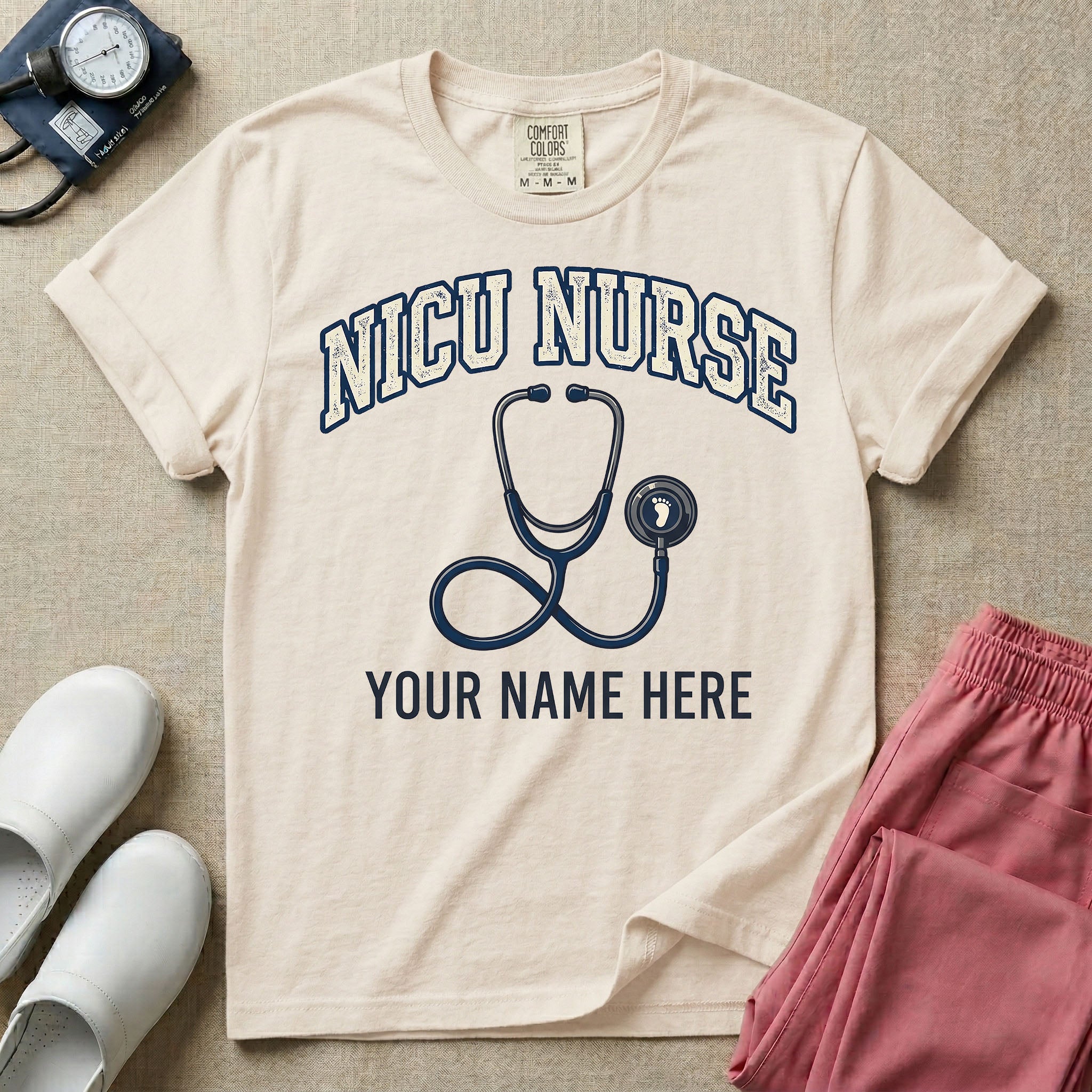 NICU nurse graphic featuring the collegiate text NICU NURSE arched over a stethoscope with a baby footprint on the bell, with the text YOUR NAME HERE at the bottom for custom personalization.