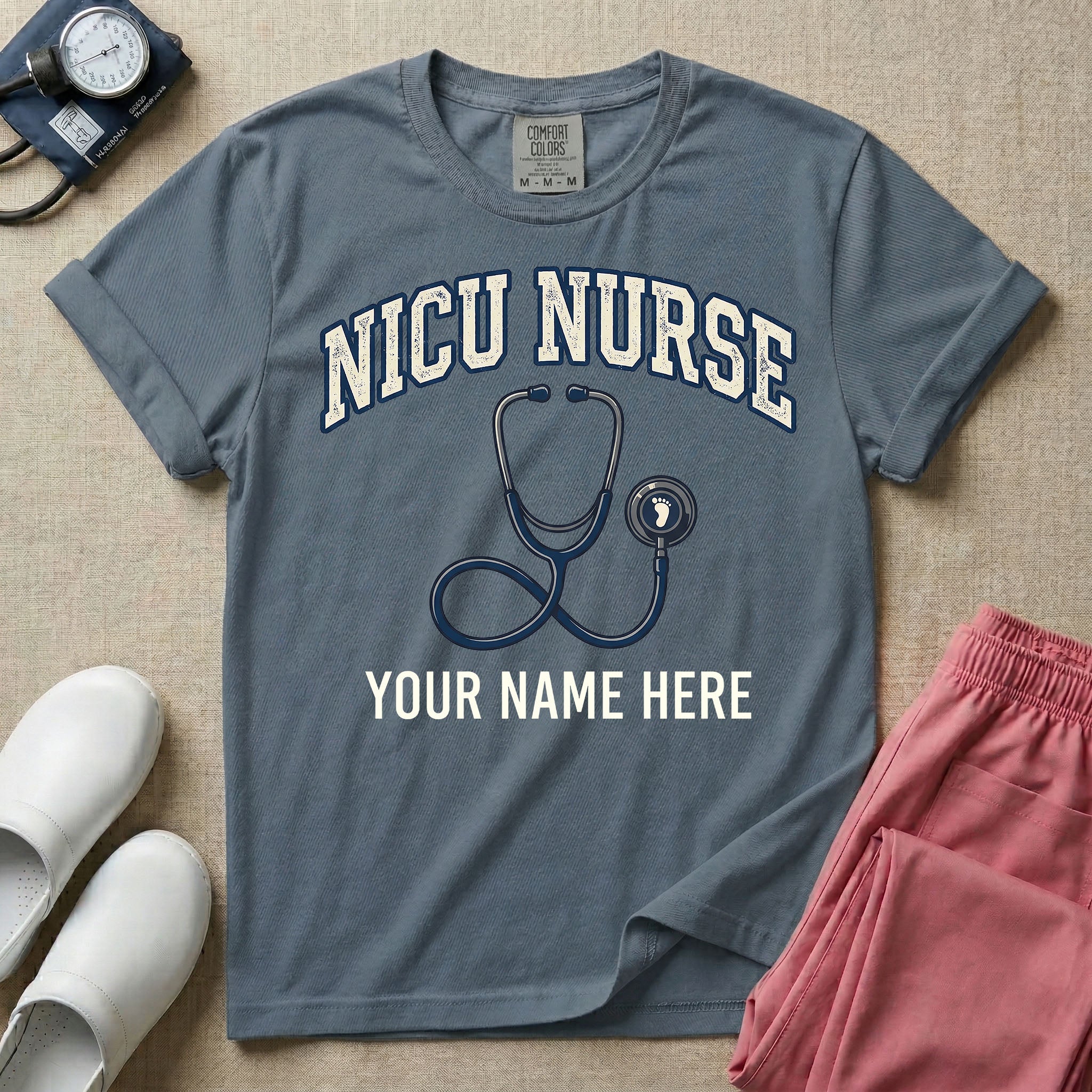 NICU nurse graphic featuring the collegiate text NICU NURSE arched over a stethoscope with a baby footprint on the bell, with the text YOUR NAME HERE at the bottom for custom personalization.