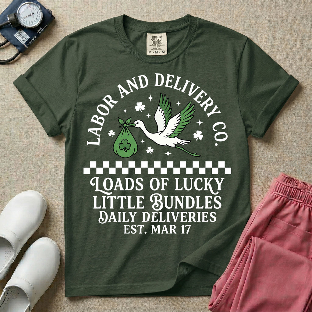A retro Labor and Delivery nurse design featuring a flying stork carrying a sack with a shamrock, surrounded by stars and clovers, above a checkered border and the text "Labor and Delivery Co. Loads Of Lucky Little Bundles Daily Deliveries Est. Mar 17".