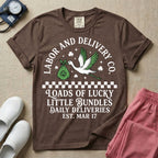 A retro Labor and Delivery nurse design featuring a flying stork carrying a sack with a shamrock, surrounded by stars and clovers, above a checkered border and the text "Labor and Delivery Co. Loads Of Lucky Little Bundles Daily Deliveries Est. Mar 17".