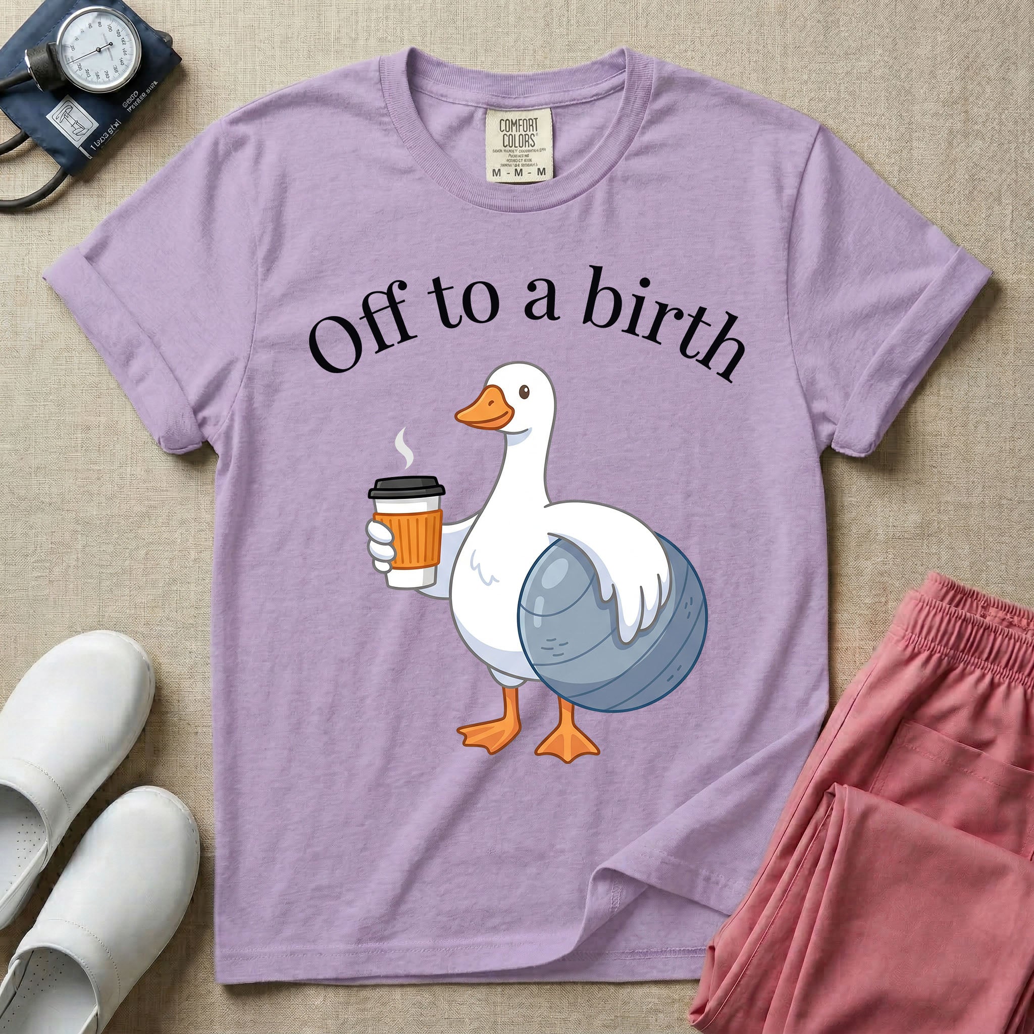 A humorous Labor and Delivery, Midwife, or Doula design featuring a cute cartoon white duck holding a steaming coffee cup and a birthing ball beneath the text "Off to a birth".