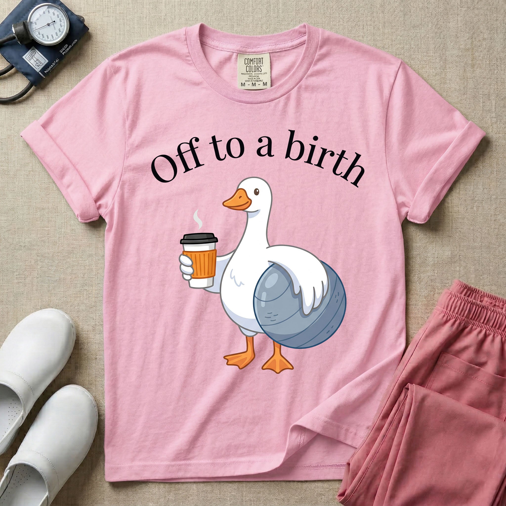 A humorous Labor and Delivery, Midwife, or Doula design featuring a cute cartoon white duck holding a steaming coffee cup and a birthing ball beneath the text "Off to a birth".