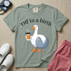 A humorous Labor and Delivery, Midwife, or Doula design featuring a cute cartoon white duck holding a steaming coffee cup and a birthing ball beneath the text "Off to a birth".