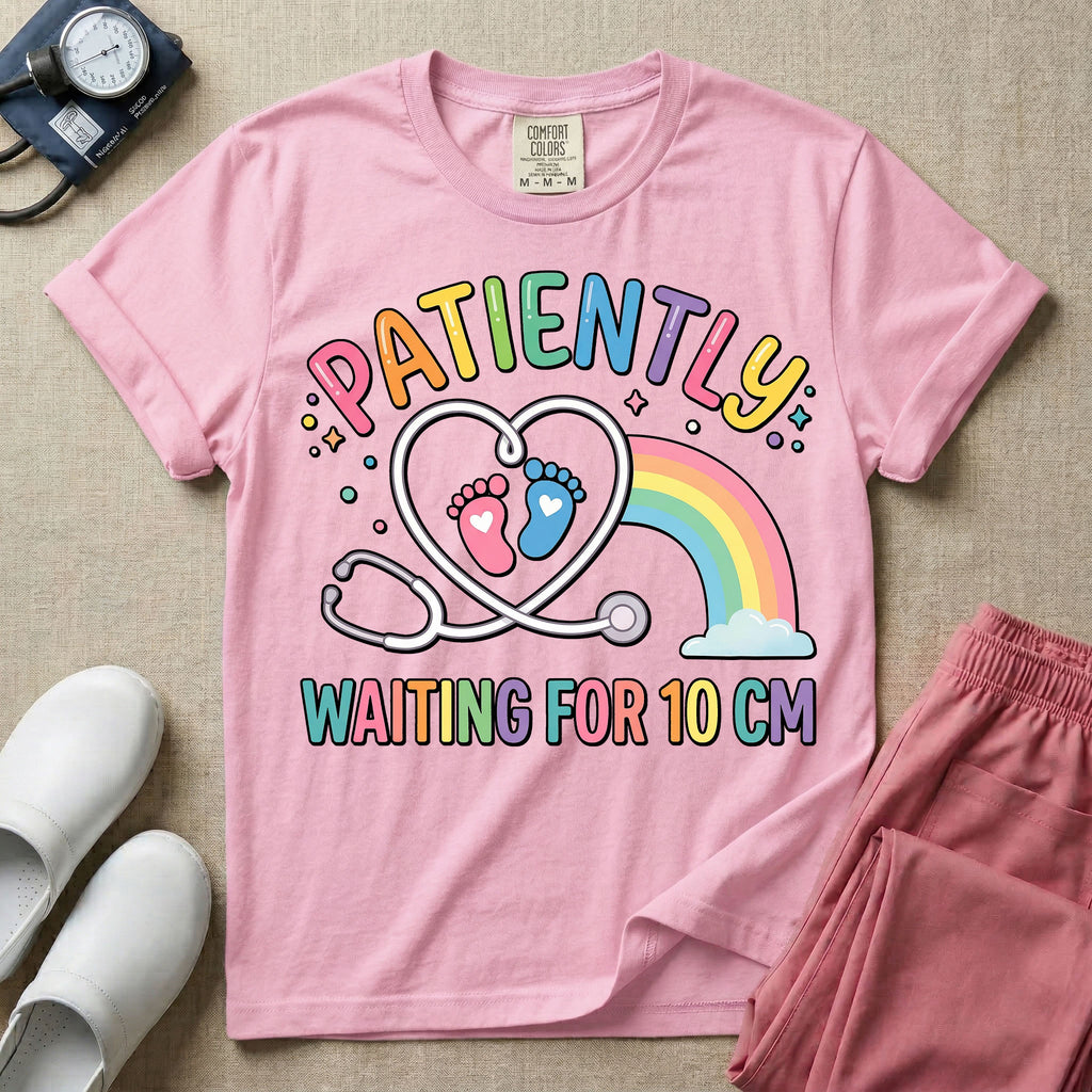 A cute Labor and Delivery and Midwife design featuring a heart-shaped stethoscope enclosing pink and blue baby footprints next to a pastel rainbow and small stars, accompanied by the text "PATIENTLY WAITING FOR 10 CM" in colorful lettering.