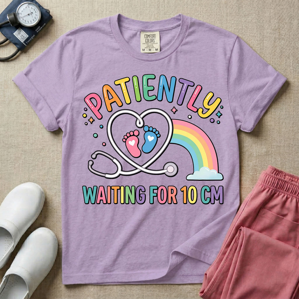 A cute Labor and Delivery and Midwife design featuring a heart-shaped stethoscope enclosing pink and blue baby footprints next to a pastel rainbow and small stars, accompanied by the text "PATIENTLY WAITING FOR 10 CM" in colorful lettering.