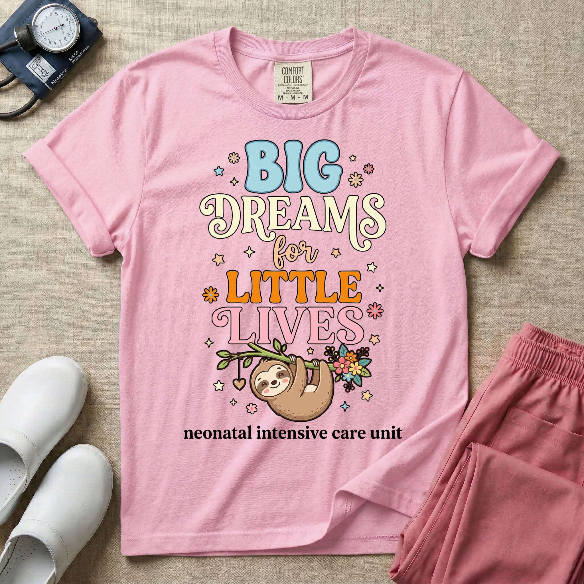 A cute Neonatal Intensive Care Unit nurse design featuring a smiling sloth hanging from a leafy branch decorated with colorful flowers and a dangling heart, surrounded by small stars, beneath the text "BIG Dreams for LITTLE LIVES neonatal intensive care unit" in varied, colorful typography.