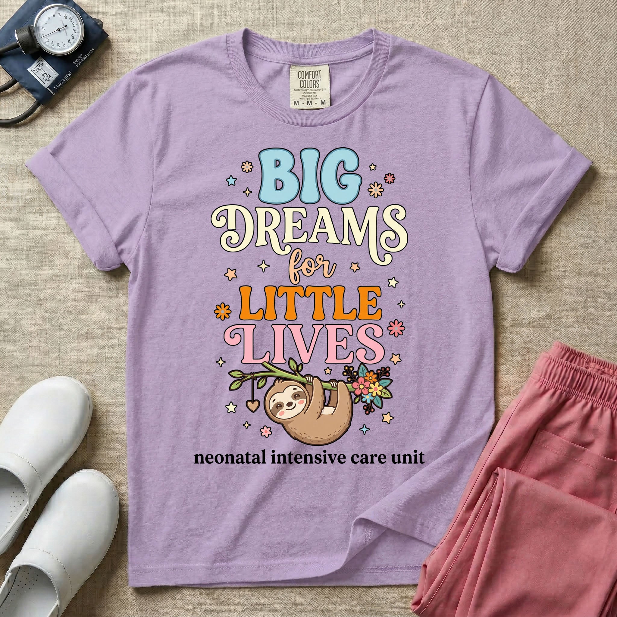 A cute Neonatal Intensive Care Unit nurse design featuring a smiling sloth hanging from a leafy branch decorated with colorful flowers and a dangling heart, surrounded by small stars, beneath the text "BIG Dreams for LITTLE LIVES neonatal intensive care unit" in varied, colorful typography.