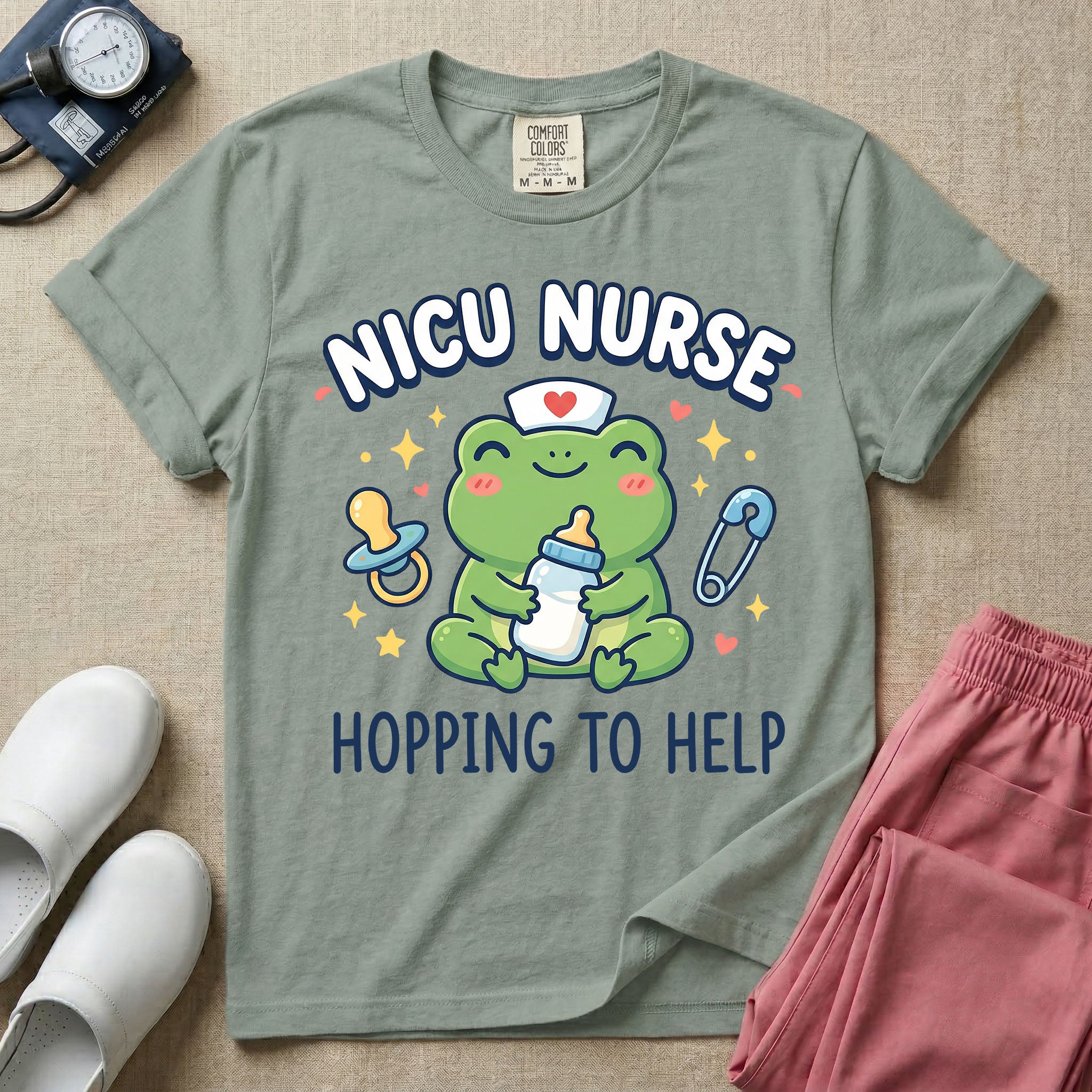 A cute Neonatal Intensive Care Unit nurse design featuring a smiling green frog wearing a nurse hat with a red heart, holding a baby bottle, accompanied by a floating pacifier, safety pin, stars, and hearts, surrounded by the text "NICU NURSE HOPPING TO HELP".