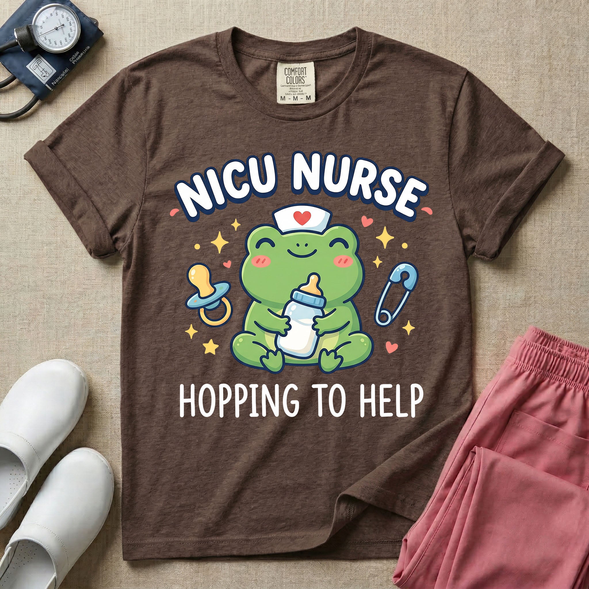 A cute Neonatal Intensive Care Unit nurse design featuring a smiling green frog wearing a nurse hat with a red heart, holding a baby bottle, accompanied by a floating pacifier, safety pin, stars, and hearts, surrounded by the text "NICU NURSE HOPPING TO HELP".