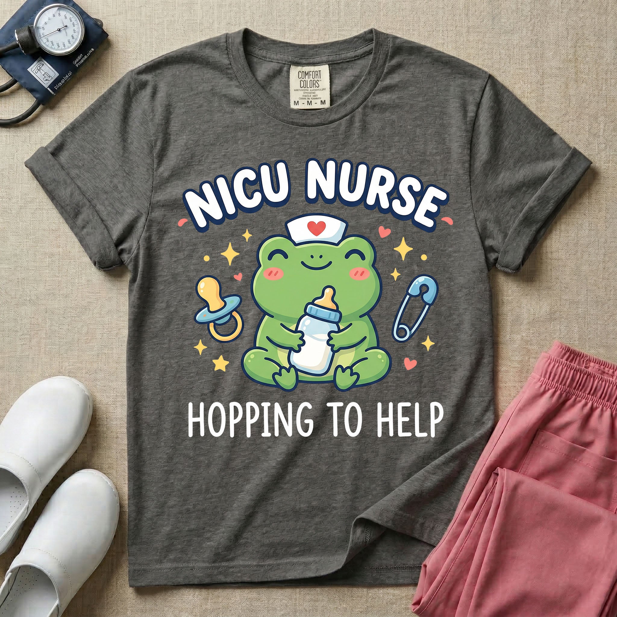 A cute Neonatal Intensive Care Unit nurse design featuring a smiling green frog wearing a nurse hat with a red heart, holding a baby bottle, accompanied by a floating pacifier, safety pin, stars, and hearts, surrounded by the text "NICU NURSE HOPPING TO HELP".