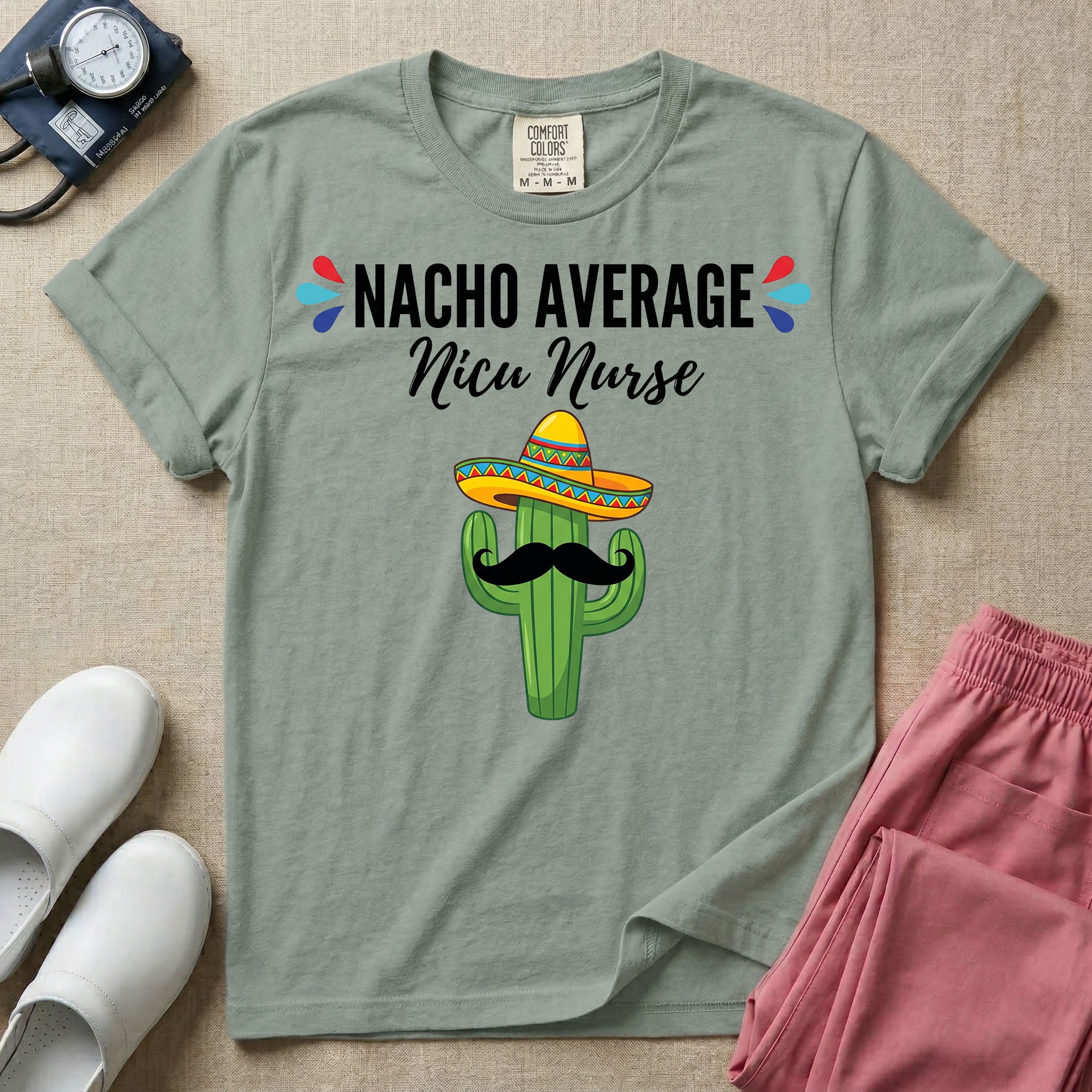 A humorous Neonatal Intensive Care Unit nurse design featuring a green cactus wearing a colorful striped sombrero and a black mustache, positioned below the text "NACHO AVERAGE Nicu Nurse" with red and blue decorative teardrop accents.