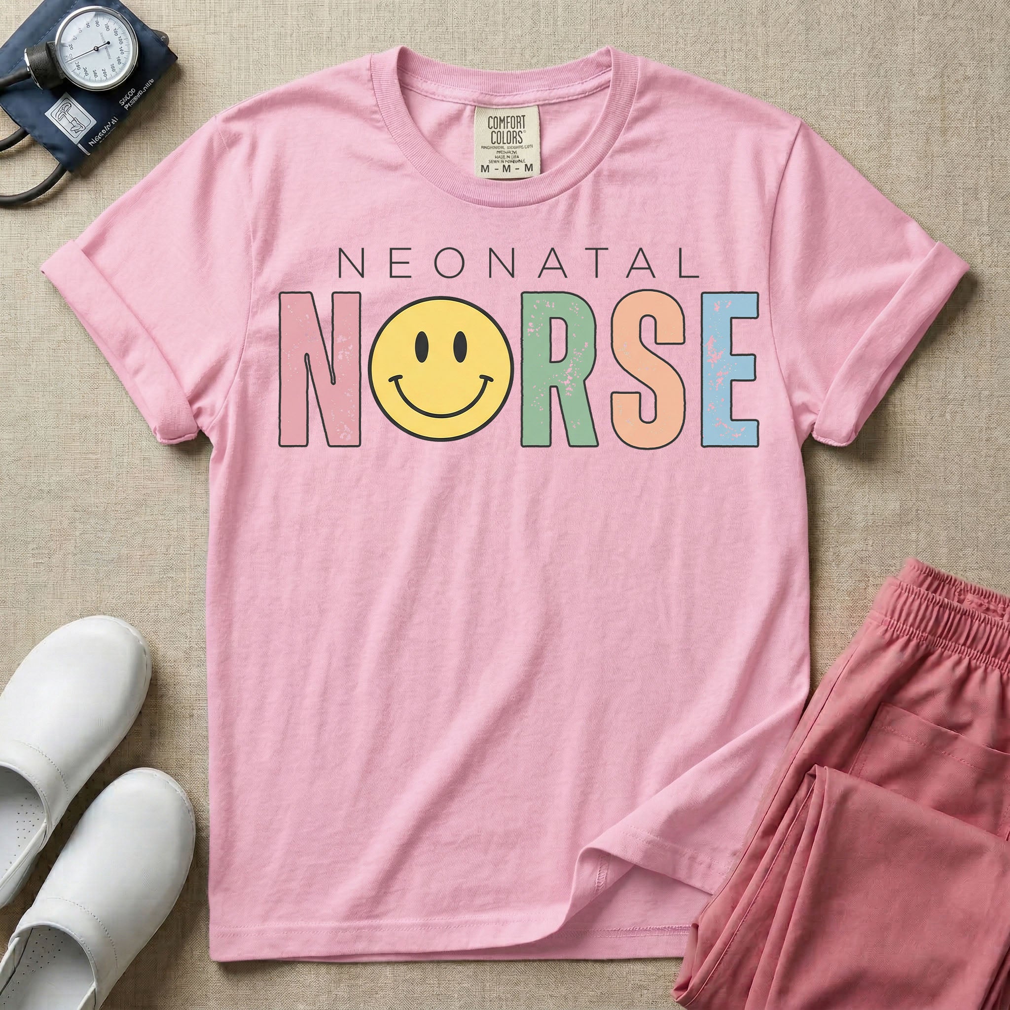 A retro Neonatal Intensive Care Unit nurse design featuring the word "NEONATAL" in simple white lettering above the word "NURSE" spelled out in large, distressed, pastel-colored letters, with a classic yellow smiley face replacing the letter U.