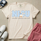 A cute Neonatal Intensive Care Unit nurse design featuring large blue and white gingham patterned letters spelling NICU, alongside a sweet white duck wearing a matching blue patterned bow, positioned above the text "neonatal intensive care unit" in a delicate cursive font.