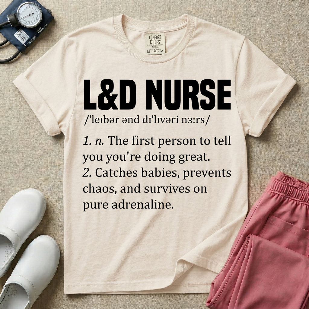 A graphic featuring a dictionary definition style layout with the bold heading L&D NURSE, followed by the phonetic pronunciation and two humorous definitions reading "1. n. The first person to tell you you're doing great." and "2. Catches babies, prevents chaos, and survives on pure adrenaline." in white text, designed for labor and delivery nurses.