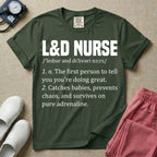 A graphic featuring a dictionary definition style layout with the bold heading L&D NURSE, followed by the phonetic pronunciation and two humorous definitions reading "1. n. The first person to tell you you're doing great." and "2. Catches babies, prevents chaos, and survives on pure adrenaline." in white text, designed for labor and delivery nurses.
