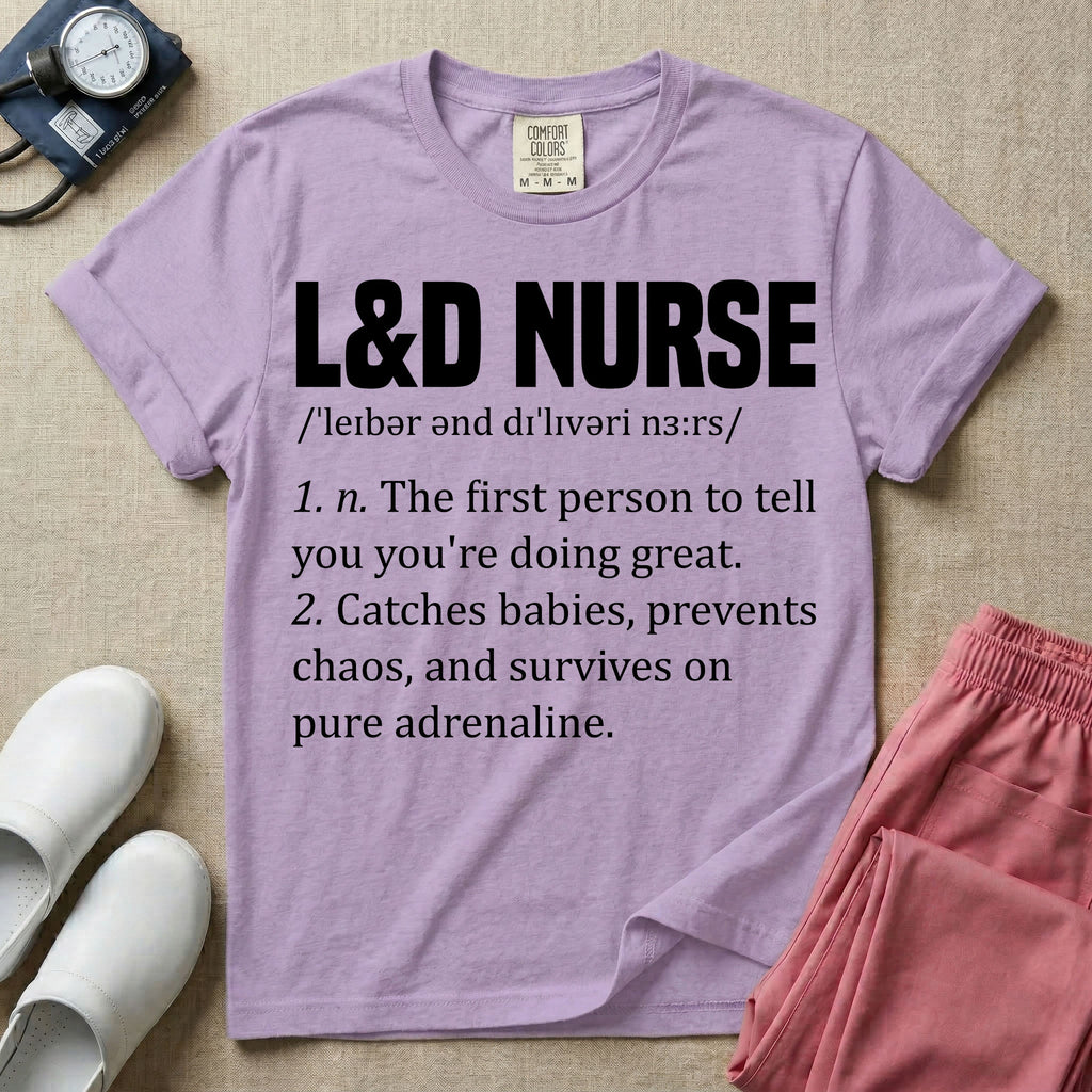 A graphic featuring a dictionary definition style layout with the bold heading L&D NURSE, followed by the phonetic pronunciation and two humorous definitions reading "1. n. The first person to tell you you're doing great." and "2. Catches babies, prevents chaos, and survives on pure adrenaline." in white text, designed for labor and delivery nurses.