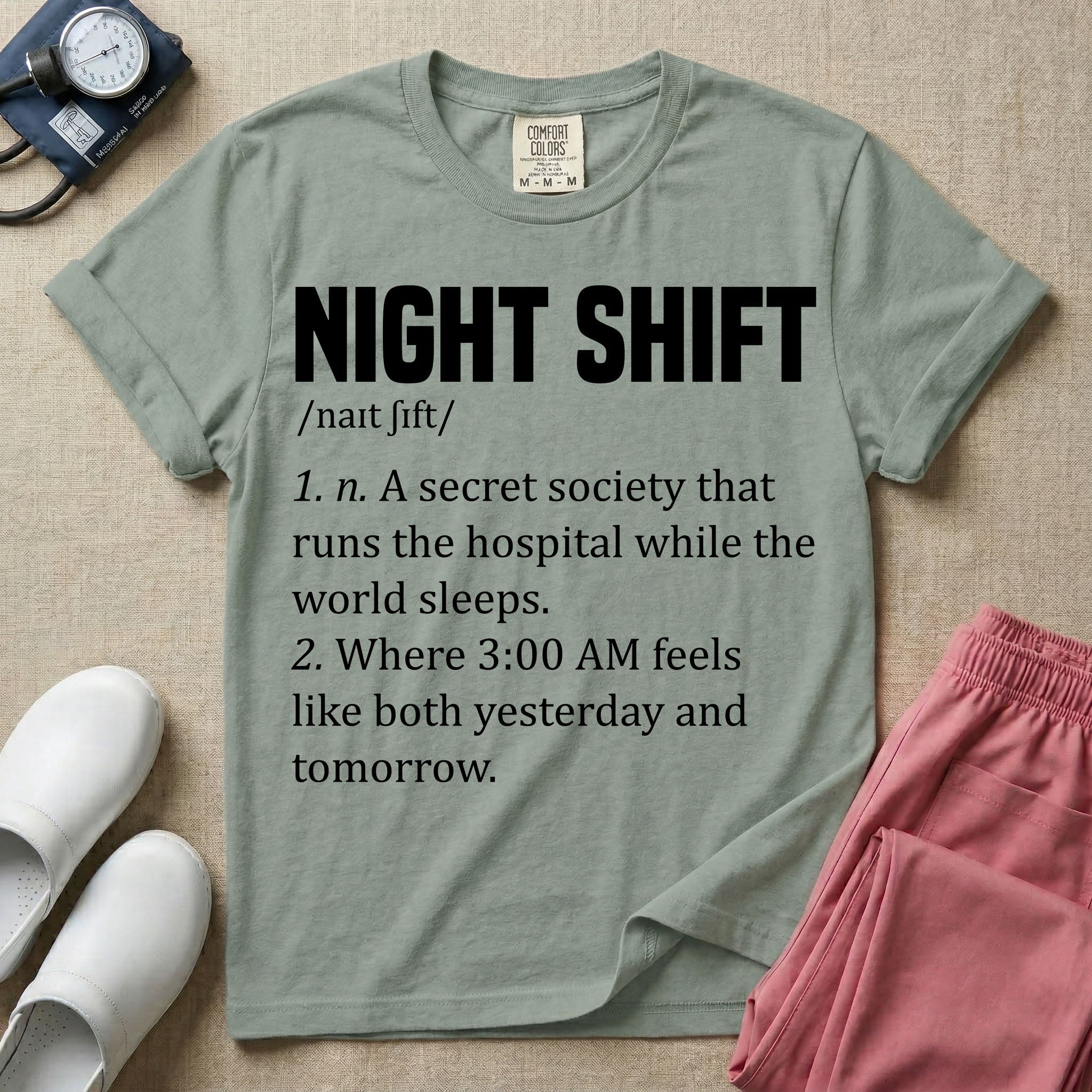 A graphic featuring a dictionary definition style layout with the bold heading NIGHT SHIFT, followed by the phonetic pronunciation and two humorous definitions reading "1. n. A secret society that runs the hospital while the world sleeps." and "2. Where 3:00 AM feels like both yesterday and tomorrow." in white text, designed for night shift nurses.