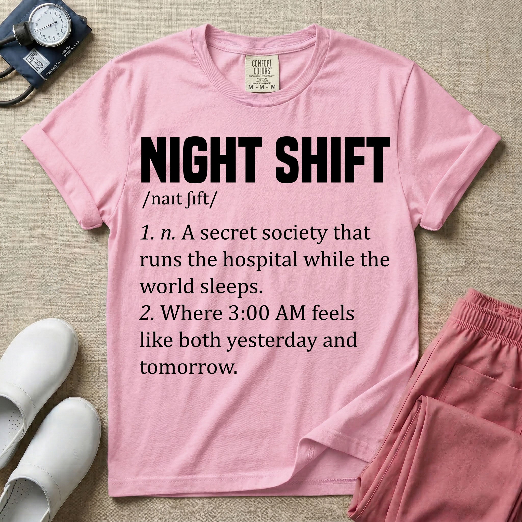 A graphic featuring a dictionary definition style layout with the bold heading NIGHT SHIFT, followed by the phonetic pronunciation and two humorous definitions reading "1. n. A secret society that runs the hospital while the world sleeps." and "2. Where 3:00 AM feels like both yesterday and tomorrow." in white text, designed for night shift nurses.