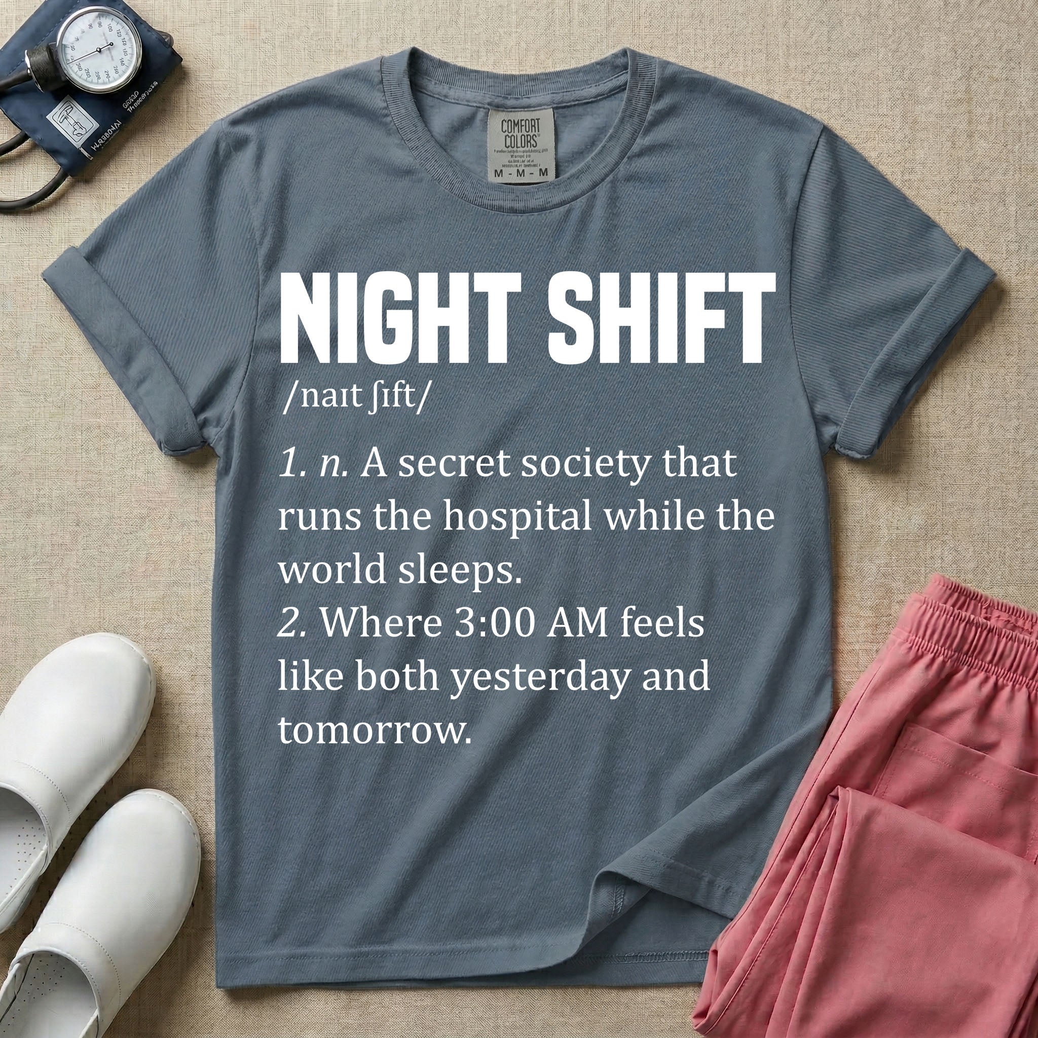A graphic featuring a dictionary definition style layout with the bold heading NIGHT SHIFT, followed by the phonetic pronunciation and two humorous definitions reading "1. n. A secret society that runs the hospital while the world sleeps." and "2. Where 3:00 AM feels like both yesterday and tomorrow." in white text, designed for night shift nurses.