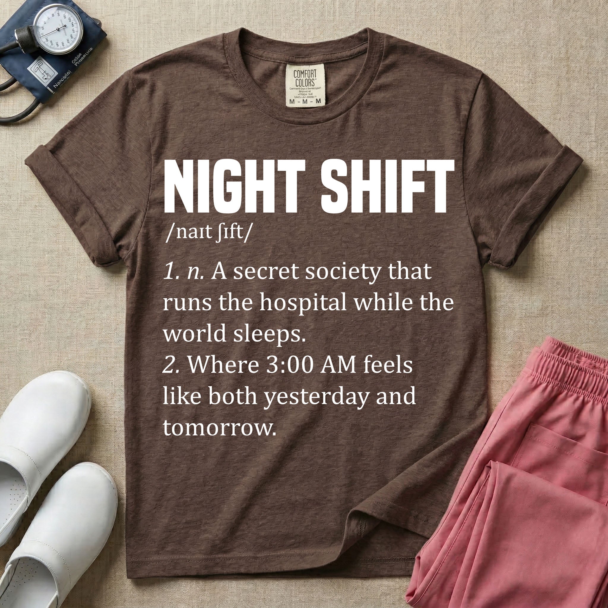 A graphic featuring a dictionary definition style layout with the bold heading NIGHT SHIFT, followed by the phonetic pronunciation and two humorous definitions reading "1. n. A secret society that runs the hospital while the world sleeps." and "2. Where 3:00 AM feels like both yesterday and tomorrow." in white text, designed for night shift nurses.