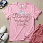 A graphic featuring the phrase "Delivering miracles daily" in elegant pink cursive script, topped with a delicate light blue ribbon bow and surrounded by sparkling stars, designed for labor and delivery, postpartum, and NICU nurses.